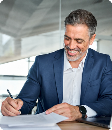 Professional man writing at a desk